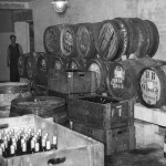 Hogsheads awaiting bottling. Note cellars were lit by gas lamps throughout